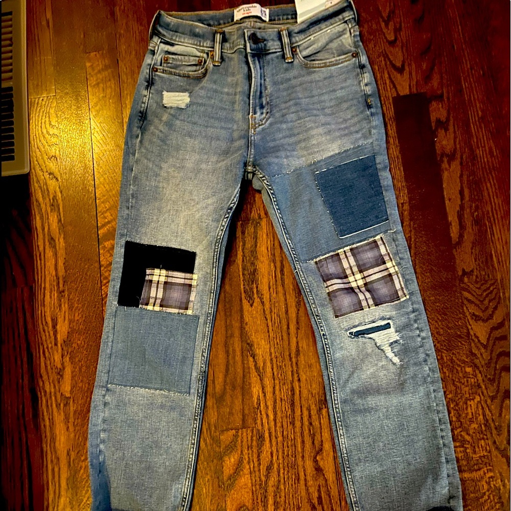New with tags, Abercrombie and Fitch boys jeans size 15/16 with patches